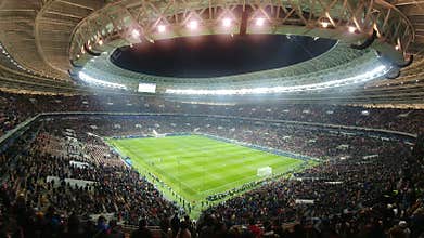 Stadium full of people watching a soccer game