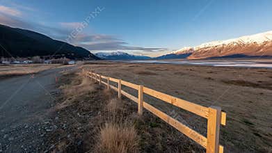 Medium shot of durable fencing installed along airport perimeter designed to prevent wildlife from accessing runways and