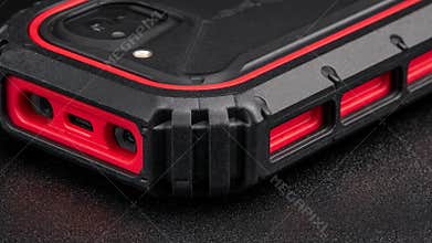 Medium shot focusing on an impactresistant pager case with reinforced corners designed to withstand heavy industrial use