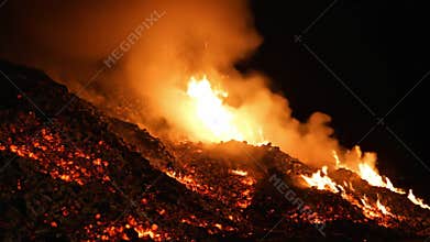 Bright flames dance and roar over a hillside under the dark night sky creating a mesmerizing, fiery spectacle Generative AI