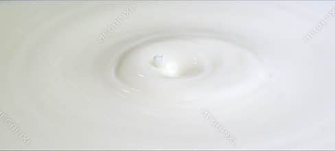 Slow-motion milk drop creates a perfect crown splash