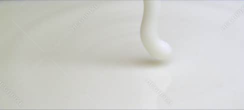 Slow-motion milk drop creates a perfect crown splash