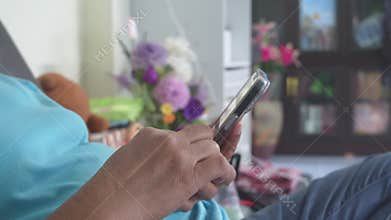 Close-up of senior woman's hands using smartphone in everyday modern lifestyle.