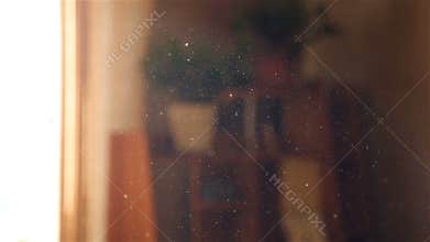 Dust in the air. Slow motion. Sun rays