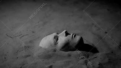 Plaster mask on the sand