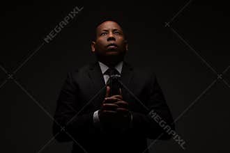 African American Christian Man Holding the Word of God, the Bible, The Scriptures