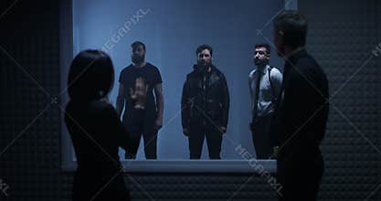 Woman identifying criminal in line-up