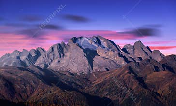 Mountain peak lighted by moonlight in autumn at night