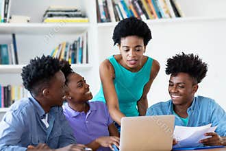 African american female teacher with students