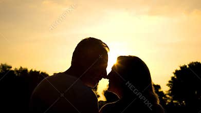 Elderly husband and wife nuzzling, happy marriage, retired couple happiness