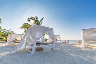 White beach canopies. Luxury beach tents at tropical resort, luxurious vacation and holiday concept t