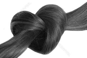 Black hair knot in shape of heart, isolated on white