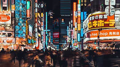 4K UHD time-lapse of crowded people crossing road and car traffic at Kabukicho, entertainment night life zone in Shinjuku, Tokyo