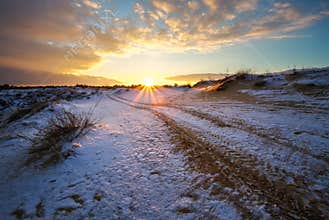 ATV auto sport track at winter. Wheel tracks on snow