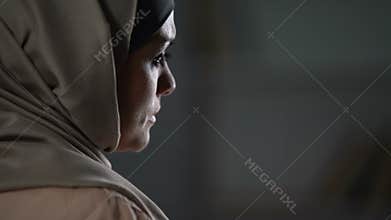 Disappointed muslim woman sighs sadly, cultural limitations, hopelessness crisis