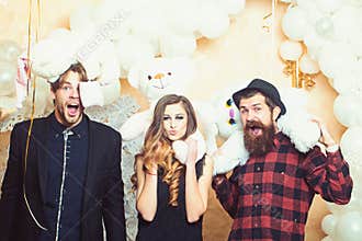Boyfriends and girlfriend with teddy bear toys. Sensual woman and men lovers. Party or holiday celebration. Happy