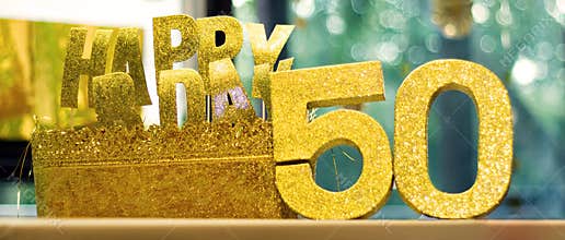 Happy 50th Birthday glittering props on a table