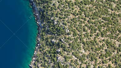 Aerial video of Greek island Poros. Vagionia bay. Paralia Vagonia. Blue water and hills. Epic panaramic footage. 4K