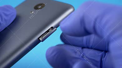 Hand in White Gloves Take Out Nano SIM Card from Smartphone