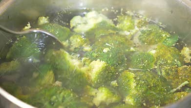 Close-up . broccoli to boil in a pan with boiling water. 4k, slow motion. copy space