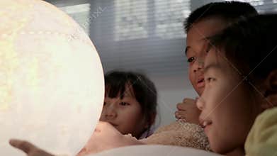 Children`s group learning about geography at bedroom.