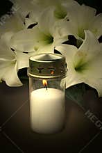 Candle and flowers for condolences