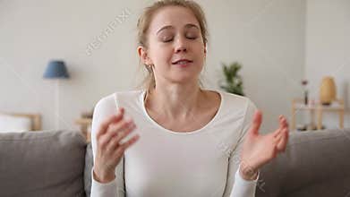 Happy girl vlogger youtuber speaking looking at camera recording vlog