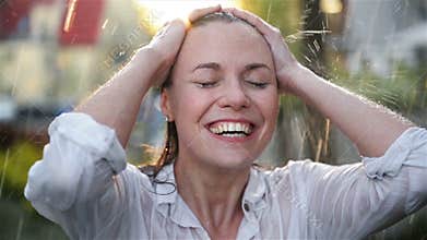 Happy Young Smiling Woman Having Fun In Rainy Weather. Cheerful Lady Has Wet Hair In Summer Park.