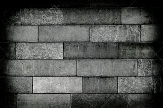 Old stone brick wall with dark vignette borders