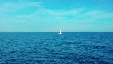 Aerial view. Catamaran goes by sea, camera move closer and fly over vessel, on the sunset, Beautiful view
