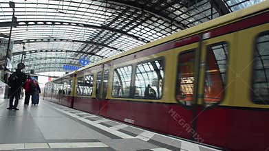 Passengers waiting for a train on subway station. Public transport. Berlin Hauptbahnhof railway station, Germany. People entering