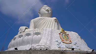 Slowmotion steadicam shot of a Big Buddha statue on Phuket island. Travel to Thailand concept