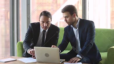Male broker consulting client with laptop handshake make deal