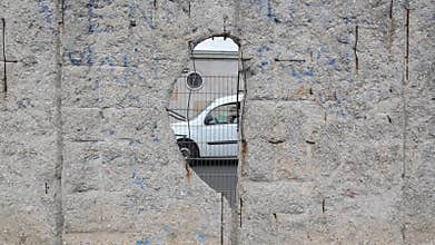 Preserved section of the Berlin Wall. The Berlin Wall was concrete barrier separating Berlin into east and west during cold war. T