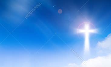 Holy light of crucifix cross on blue sky background. Hope and freedom concept