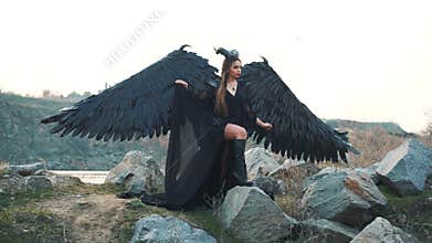 Gloomy picture, black queen of darkness waiting for her awesome army, raven girl with big strong wings and frightening