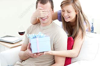 Smiling woman giving a present to her boyfriend