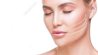 Portrait of attractive woman with arrows on her face over white background. Face lifting concept. Plastic surgery
