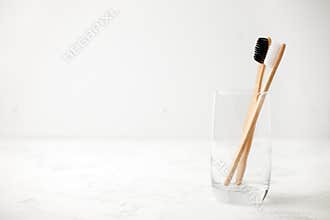 Bamboo teeth brush on minimalistic backgroud. zero waste concept, white background, eco friendly modern simple idea, copy space
