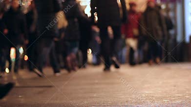 People on sidewalk. Crowded crosswalk. City life. Evening. Legs. Asphalt.