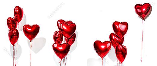 Valentine`s Day. Set of air balloons. Bunch of red heart shaped foil balloons isolated on white