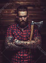 Brutal man with beard and tattooe.