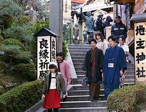 Young Japanese people visiting a temple