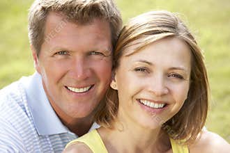 Close up of middle aged couple outdoors