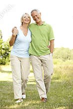 Mature couple walking in countryside