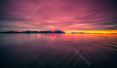 Sunset over alaska fjords on a cruise trip near ketchikan