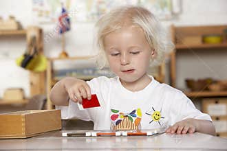 Young Girl Playing at Montessori/Pre-School