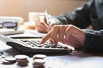 businesswoman using calculator for calculate finance accounting