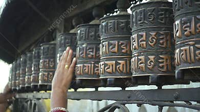 Spinning prayer wheels at the Swayambhunath Stupa, Kathmandu, Nepal.