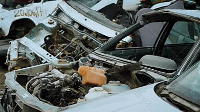 Close up shot of the car without the hood, the transport has no mirrors, it is located in a scrap heap